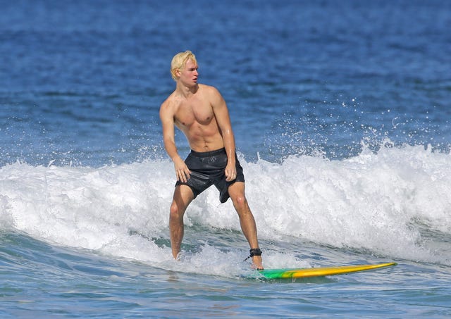 Ansel Elgort surfing